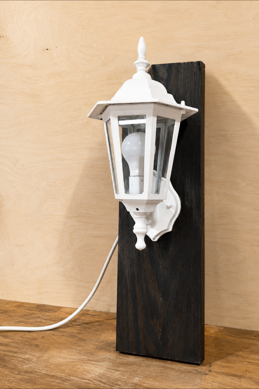 Lantern mounted on a stained wood board