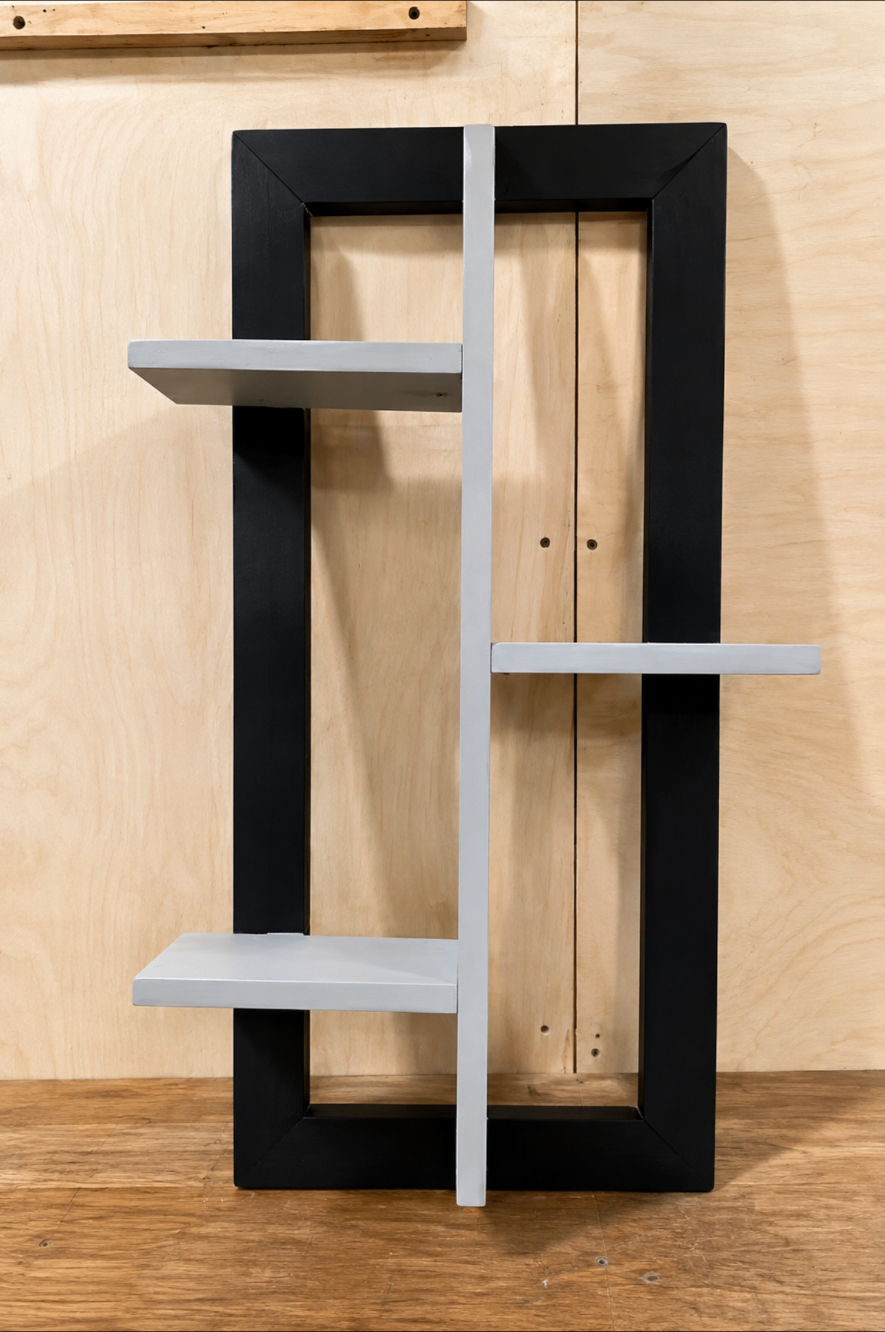 Black framed geometric wall shelf with white shelves